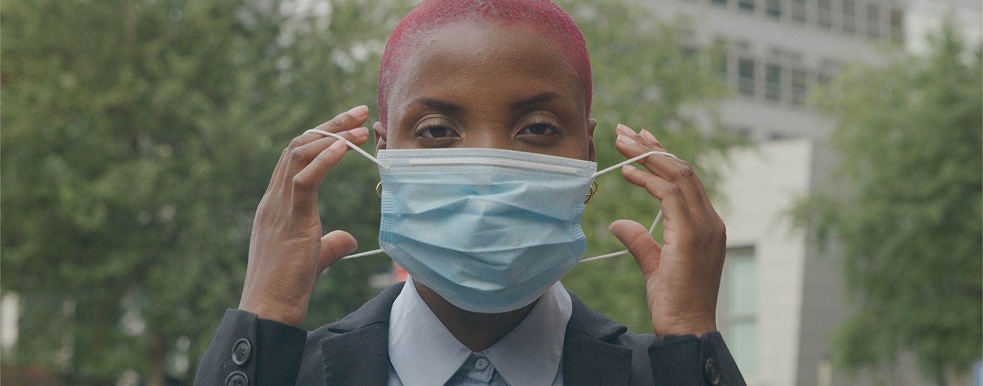 Stock video of a woman wearing a mask to stay safe in 2020