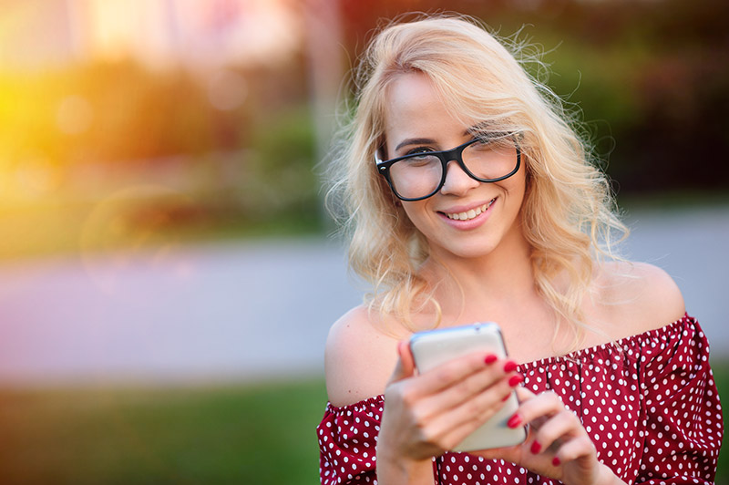 Portrait of smiling young woman outdoors