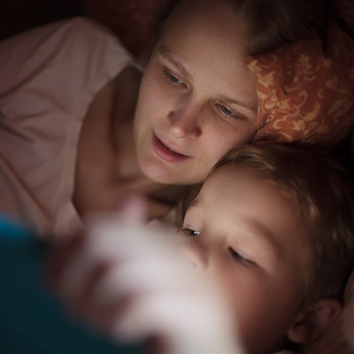 Mother and son looking at a tablet